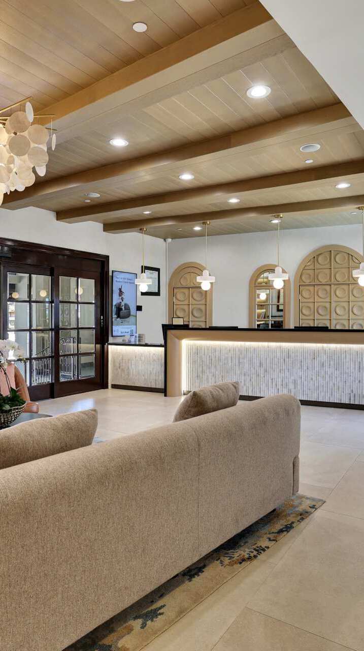 Hotel lobby with a seating area and the front desk